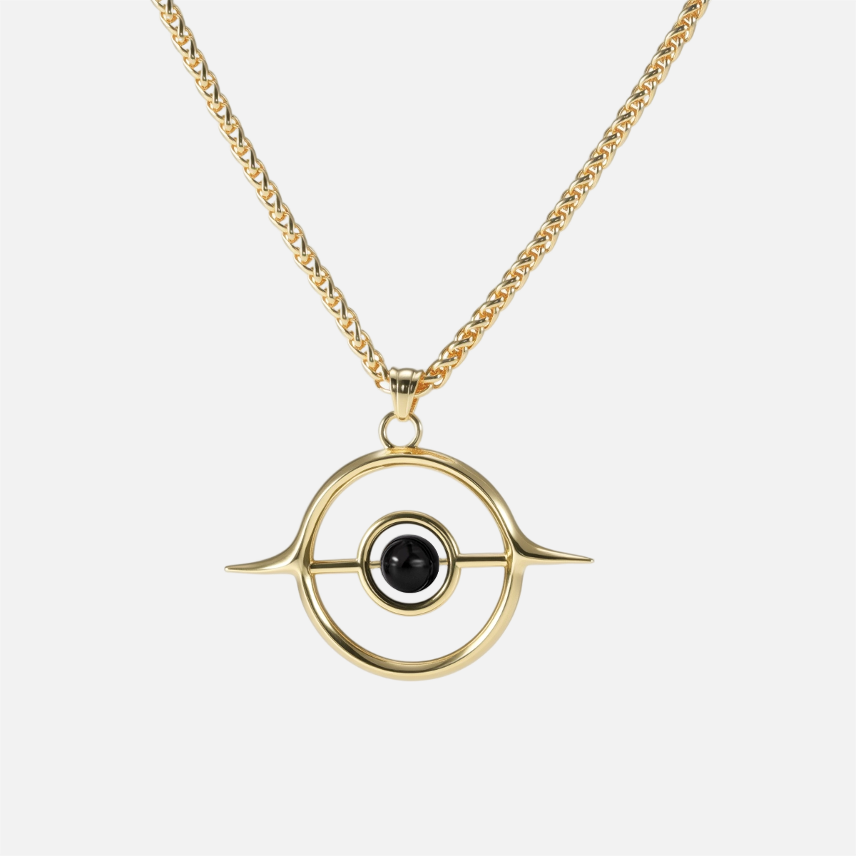 Gold Stellar Grace necklace with circular orbit pendant and black center