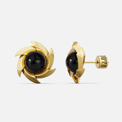 Gold-tone pinwheel stud earrings with a round black stone, front and side view