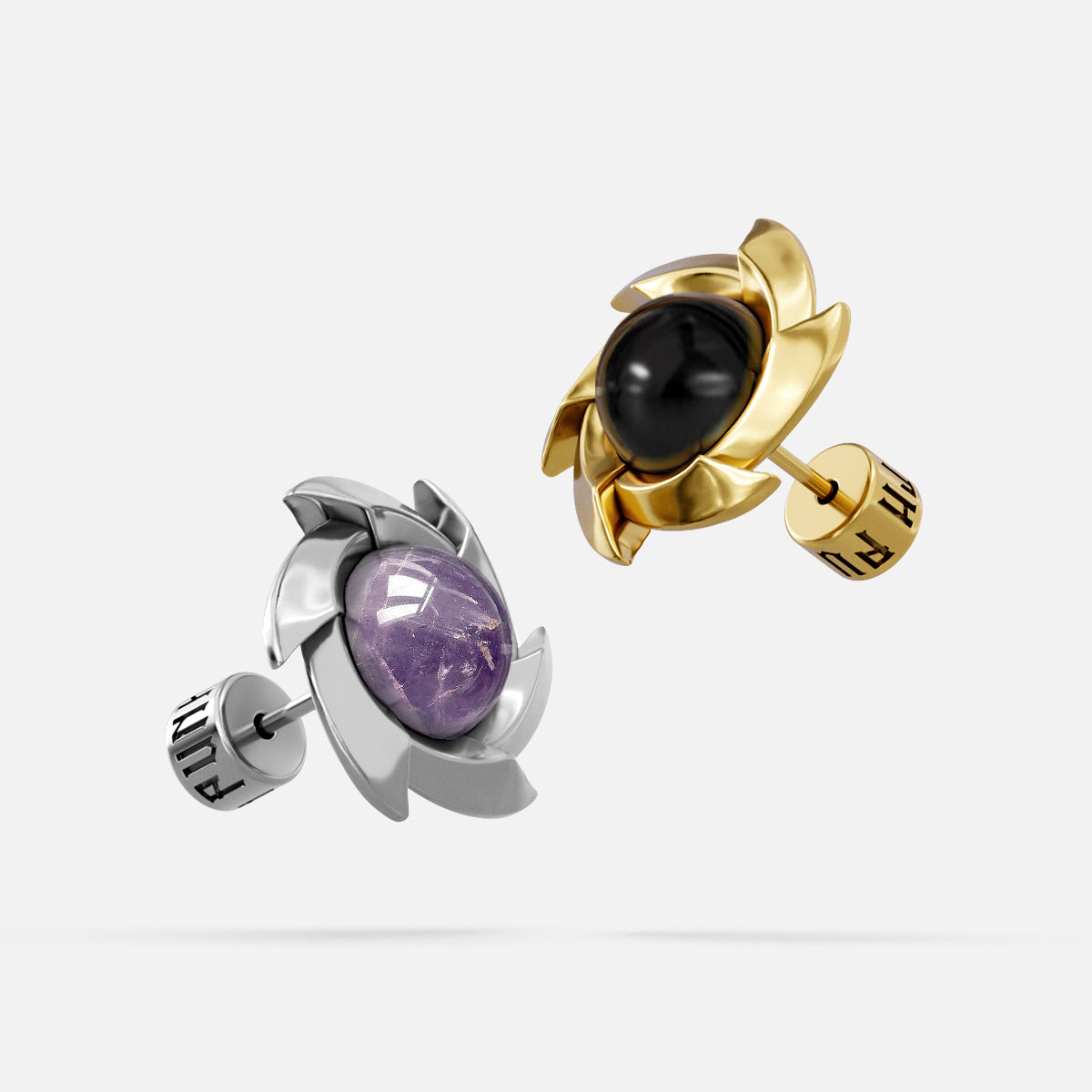 Silver and gold Stellar Nova ear studs with purple and black center accents
