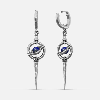 Silver-tone Stellar Orbit earrings with huggie hoops, orbit ring, blue stone center, and hammered spike drop
