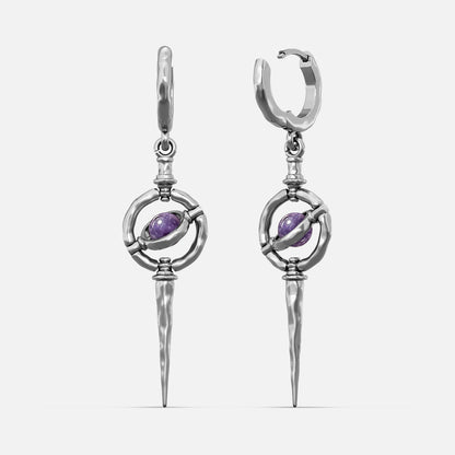 Silver-tone Stellar Orbit earrings with huggie hoops, orbit ring, purple stone center, and hammered spike drop