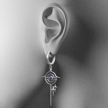 Silver Stellar Path hoop earring with purple center shown on an ear illustration