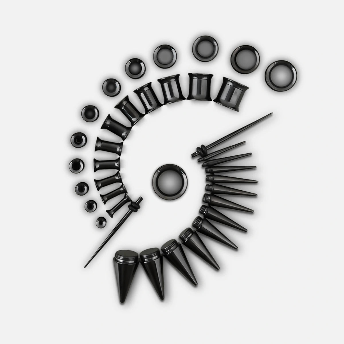 Black ear stretching kit with tapers, tunnels and plugs arranged in a spiral pattern