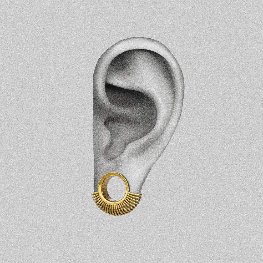 Gold Symmetrical Radiance tunnel shown on an ear illustration