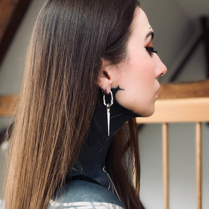 Side view of model wearing a silver Tapered Edge drop earring