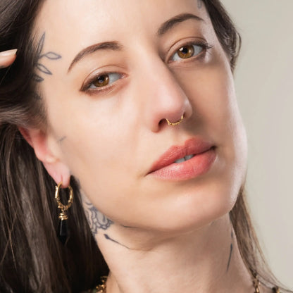 Model wearing gold Thorn Bramble Clicker with gothic woodland jewelry styling