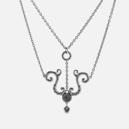 Tideworn knot necklace in antiqued silver finish with rope textured ring and layered spiral pendant