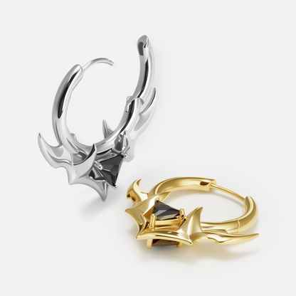 Silver and gold Trident Crest stone hoop earrings shown open and lying flat
