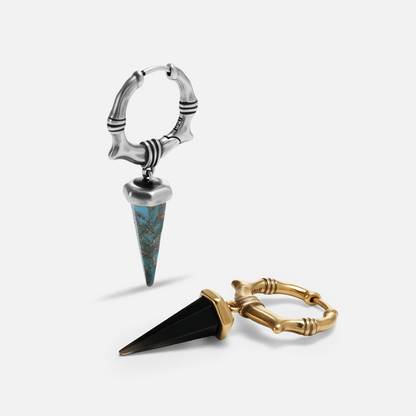 Unearthed Spike Earrings shown in silver and gold tones with faceted spike drop designs