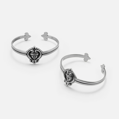 Antiqued silver-tone Veiled Seer Cuff Bracelet shown from multiple angles to display the front motif and open cuff structure.