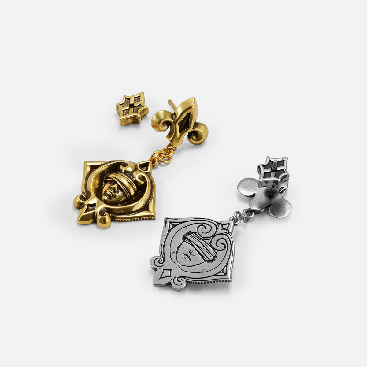 Antiqued silver- and gold-tone Veiled Seer Drop Earrings displayed from angled views to show the medallions and side profiles.