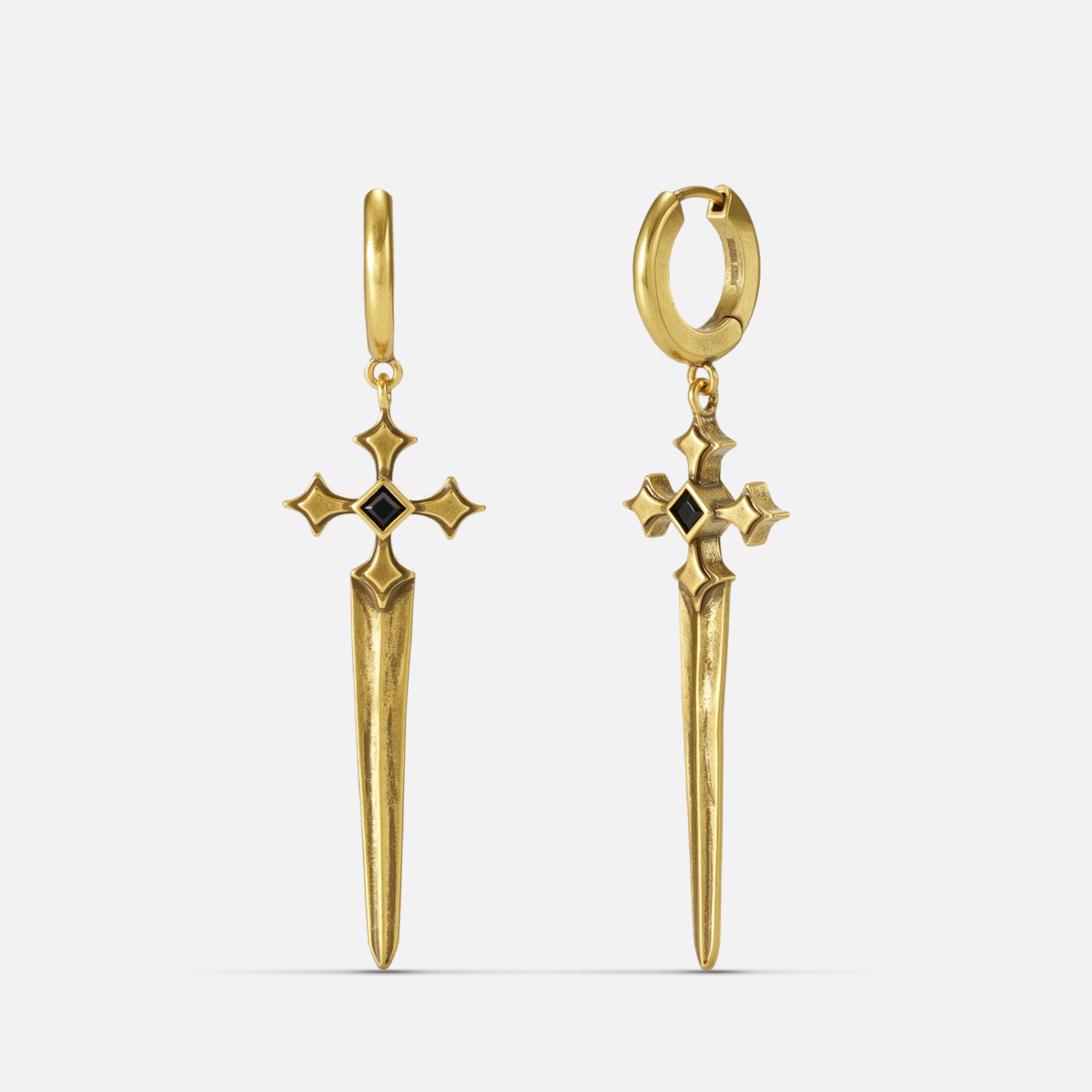 Vesper Blade Earrings in antiqued 18K gold with long blade-shaped cross drops and black obsidian, shown front and back on whi