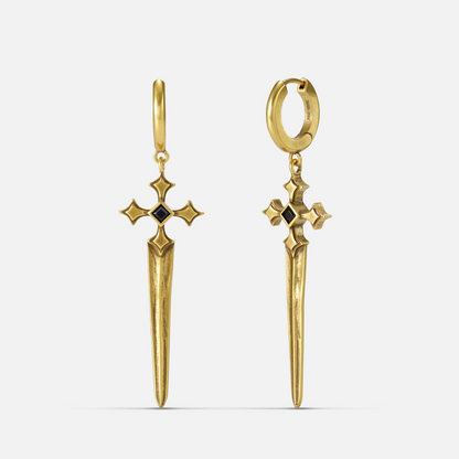 Vesper Blade Earrings in antiqued 18K gold with long blade-shaped cross drops and black obsidian, shown front and back on whi
