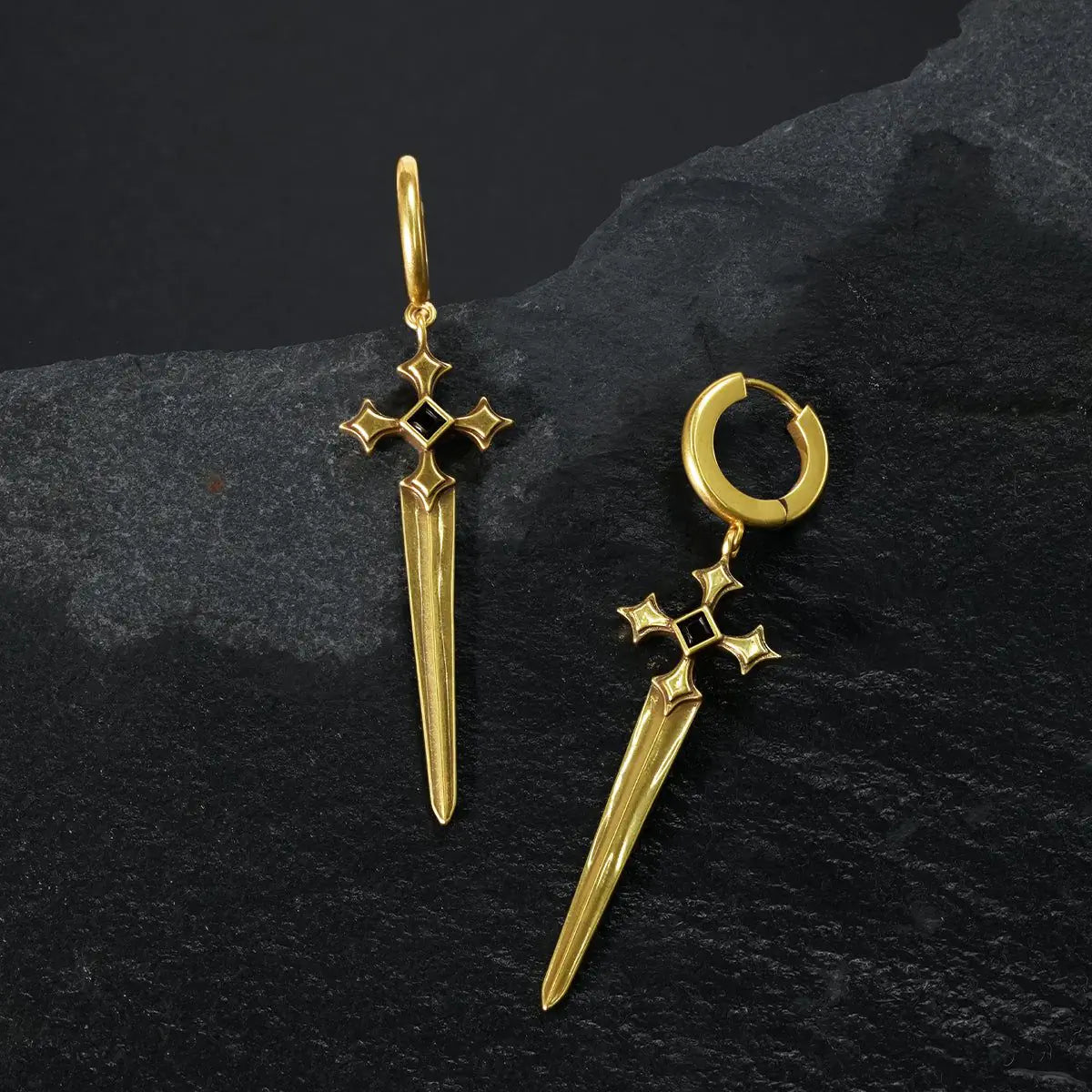 Gold Vesper Blade Earrings displayed as contrasting front and back views on black textured fabric.