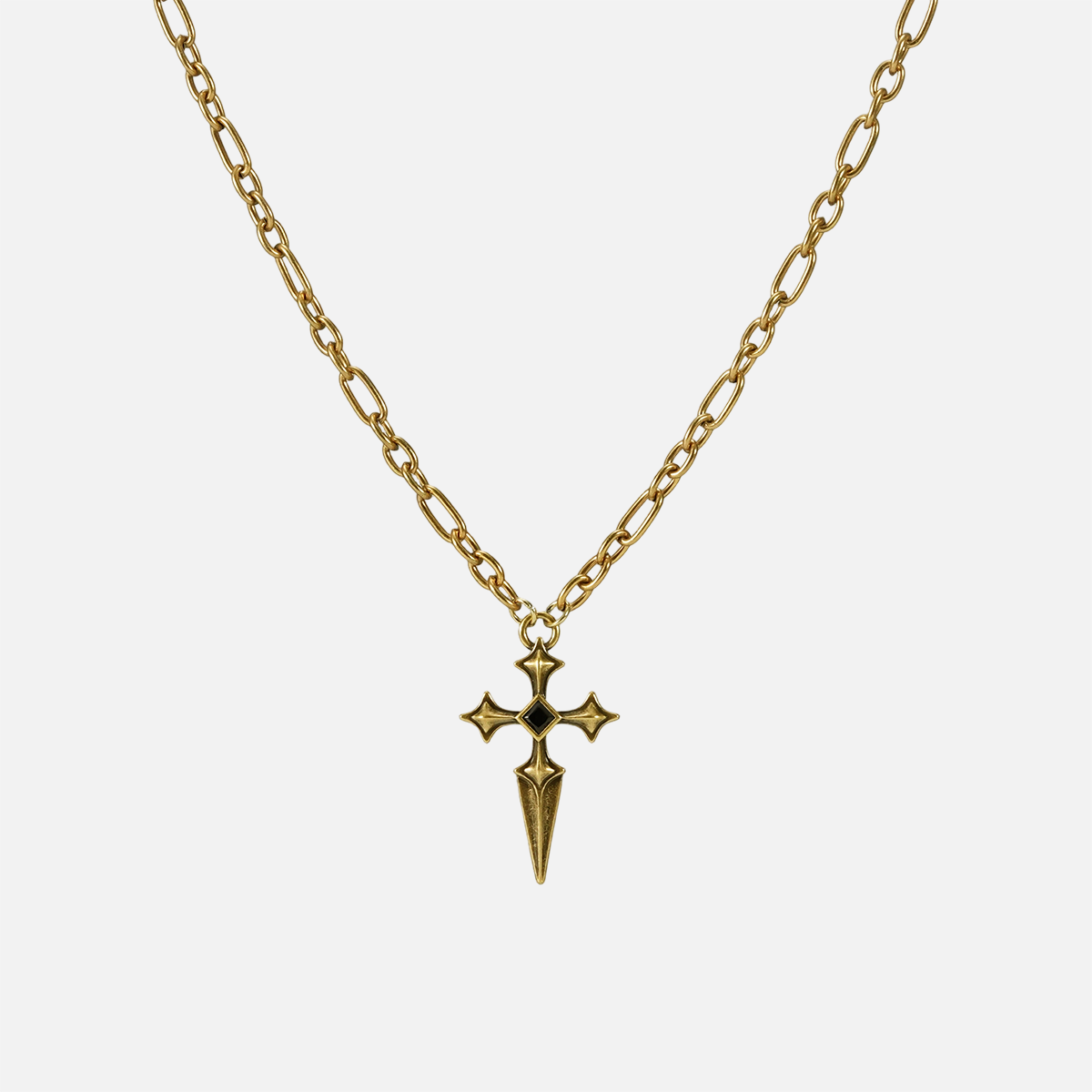 Vesper Blade Necklace in antiqued 18K gold with a blade-shaped cross pendant and black obsidian, shown full length on white.