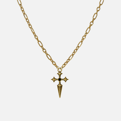 Vesper Blade Necklace in antiqued 18K gold with a blade-shaped cross pendant and black obsidian, shown full length on white.