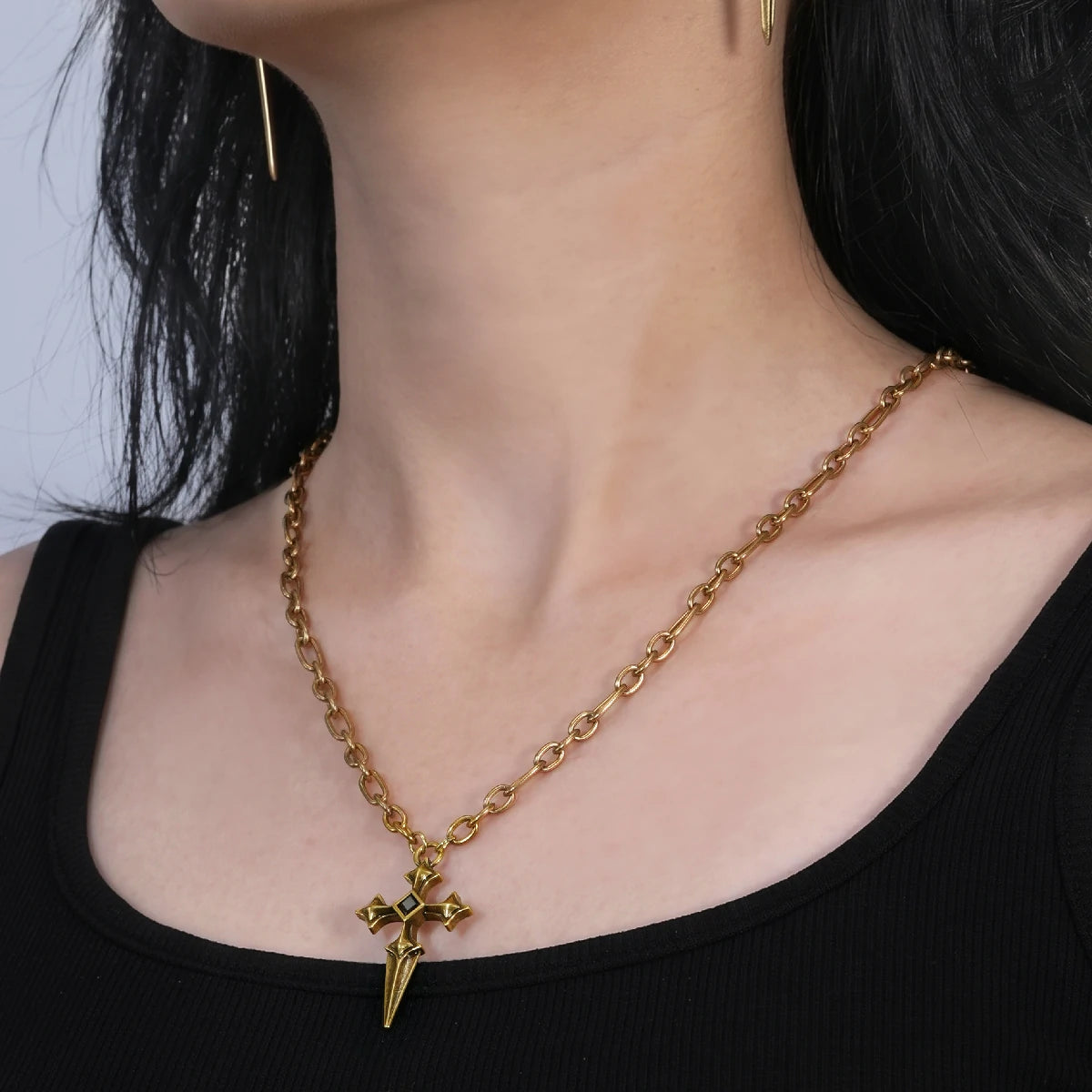 Vesper Blade Necklace in antiqued 18K gold worn over a black scoop-neck top in a closer pendant-focused neckline crop.