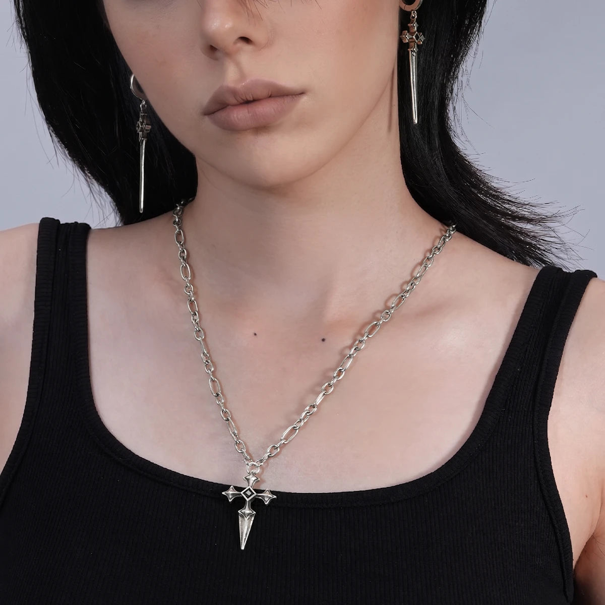 Vesper Blade Necklace in antiqued silver worn centered over a black top in a front neckline close-up.