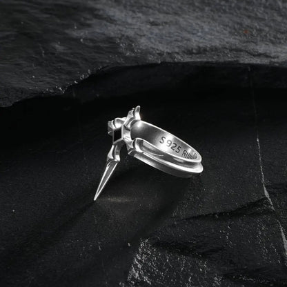 Vesper Blade Ring in silver shown at an angled side view on black textured fabric.