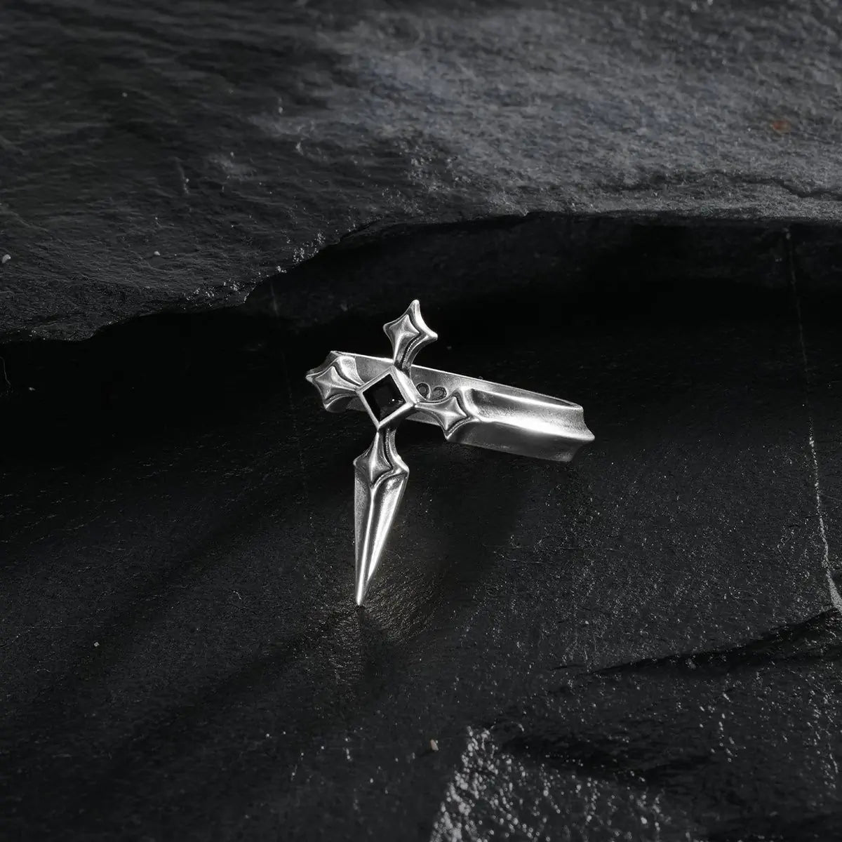 Vesper Blade Ring in silver shown from a three-quarter top view on black textured fabric.