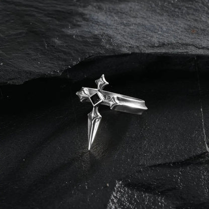 Vesper Blade Ring in silver shown from a three-quarter top view on black textured fabric.