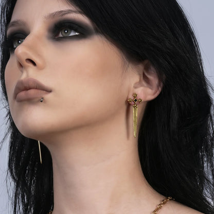 Vesper Blade Stud Earrings in antiqued 18K gold worn on the ear in an upward-looking side-profile portrait.