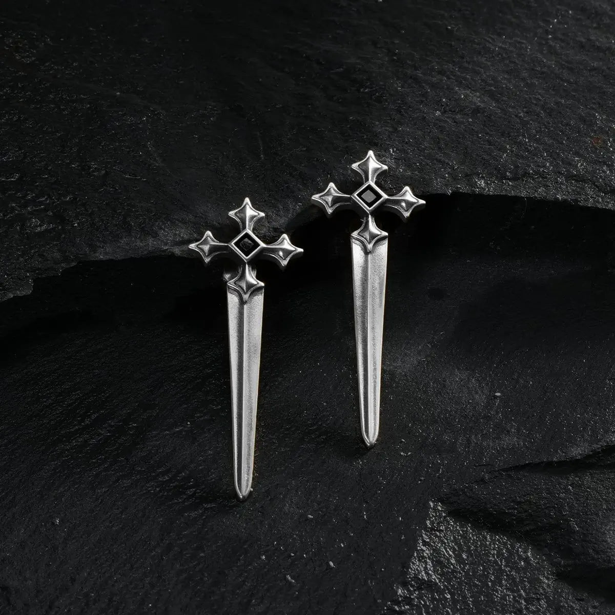 Silver Vesper Blade Stud Earrings displayed as a pair on black textured fabric.