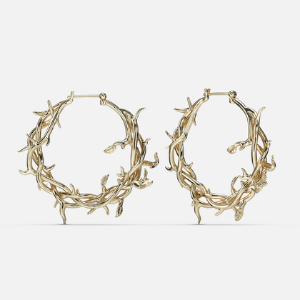Gold-tone Vine Whispers hoop earrings shaped from twisting thorny branches