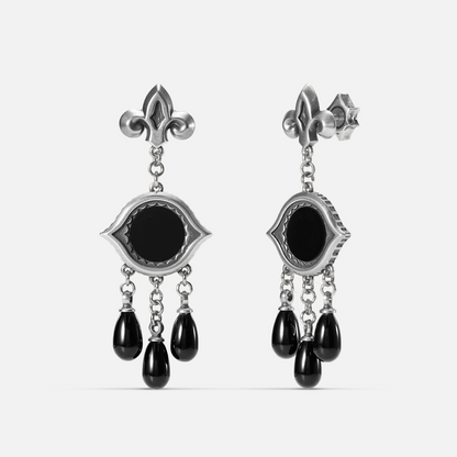 Antiqued silver-tone Votive Mirror Earrings shown from front and side views with round black obsidian centers, eye-shaped frames, and three suspended black drops.