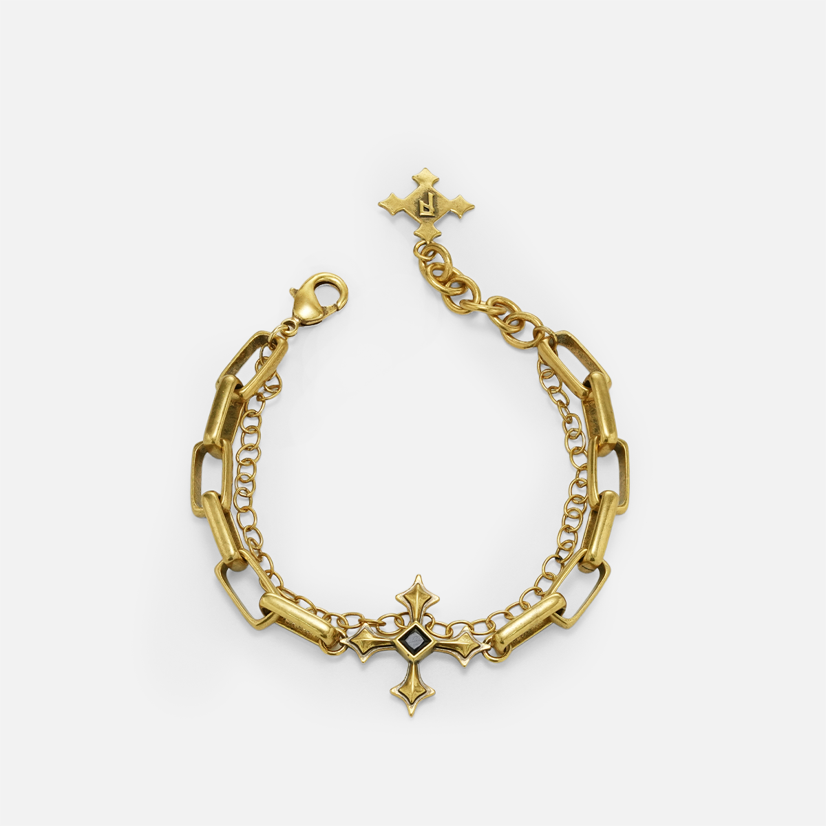 Vowbound Chain Bracelet in antiqued 18K gold with gothic chain and cross-inspired black obsidian details, shown on white.