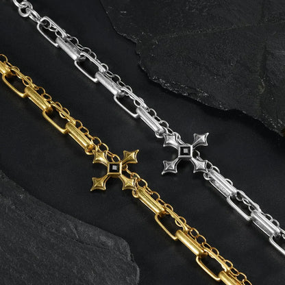 Silver and gold Vowbound Chain Bracelet links shown diagonally on black textured fabric.