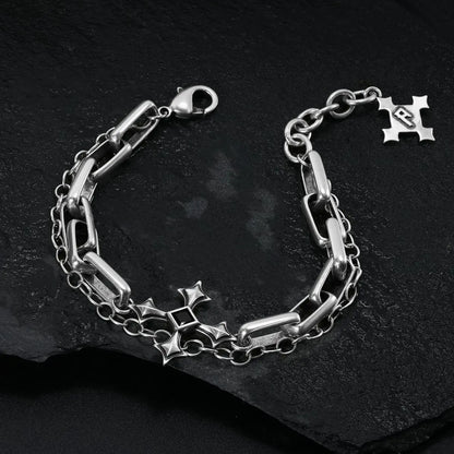 Silver Vowbound Chain Bracelet arranged in a full loop on black textured fabric.