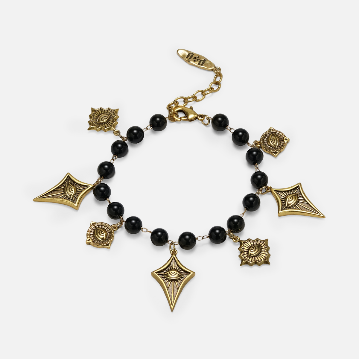 A gold and black beaded charm bracelet featuring geometric and floral charms, displayed on a light gray background.