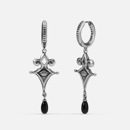Antiqued silver-tone Watcher’s Tear Earrings shown from front and side views with engraved eye motifs and suspended black teardrop accents.
