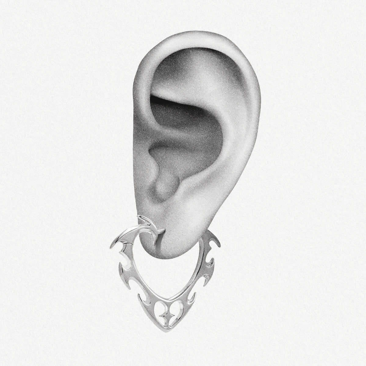 Silver Wild Heart earring shown on an ear illustration