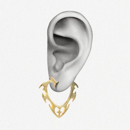 Gold Wild Heart earring shown on an ear illustration