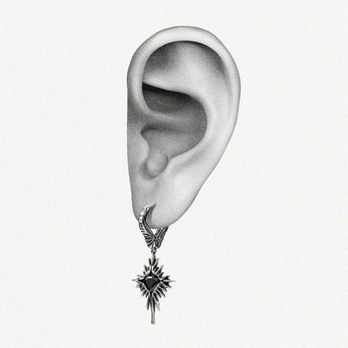 Winged Heartburst Earrings in 925 sterling silver shown on an illustrated ear to demonstrate scale and drop length.