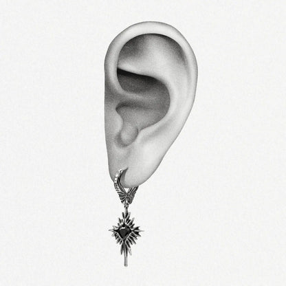 Winged Heartburst Earrings in 925 sterling silver shown on an illustrated ear to demonstrate scale and drop length.