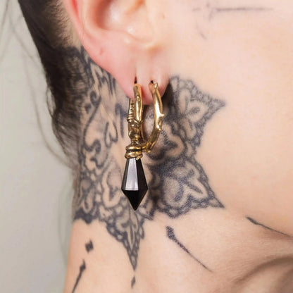 Gold Wrapped Relic Earrings styled on model with black dagger drops and gothic jewelry mood