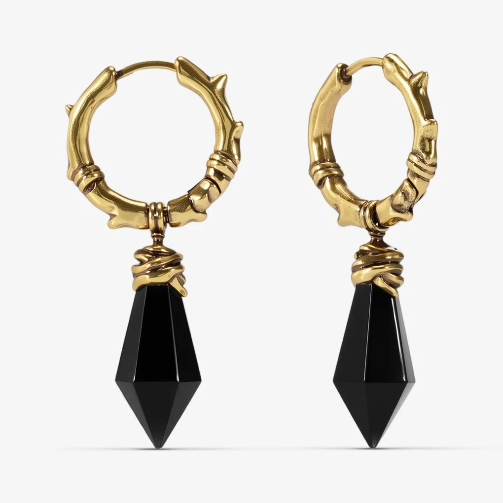 Gold-tone Wrapped Relic Earrings feature black obsidian dagger drops and hammered hoops.