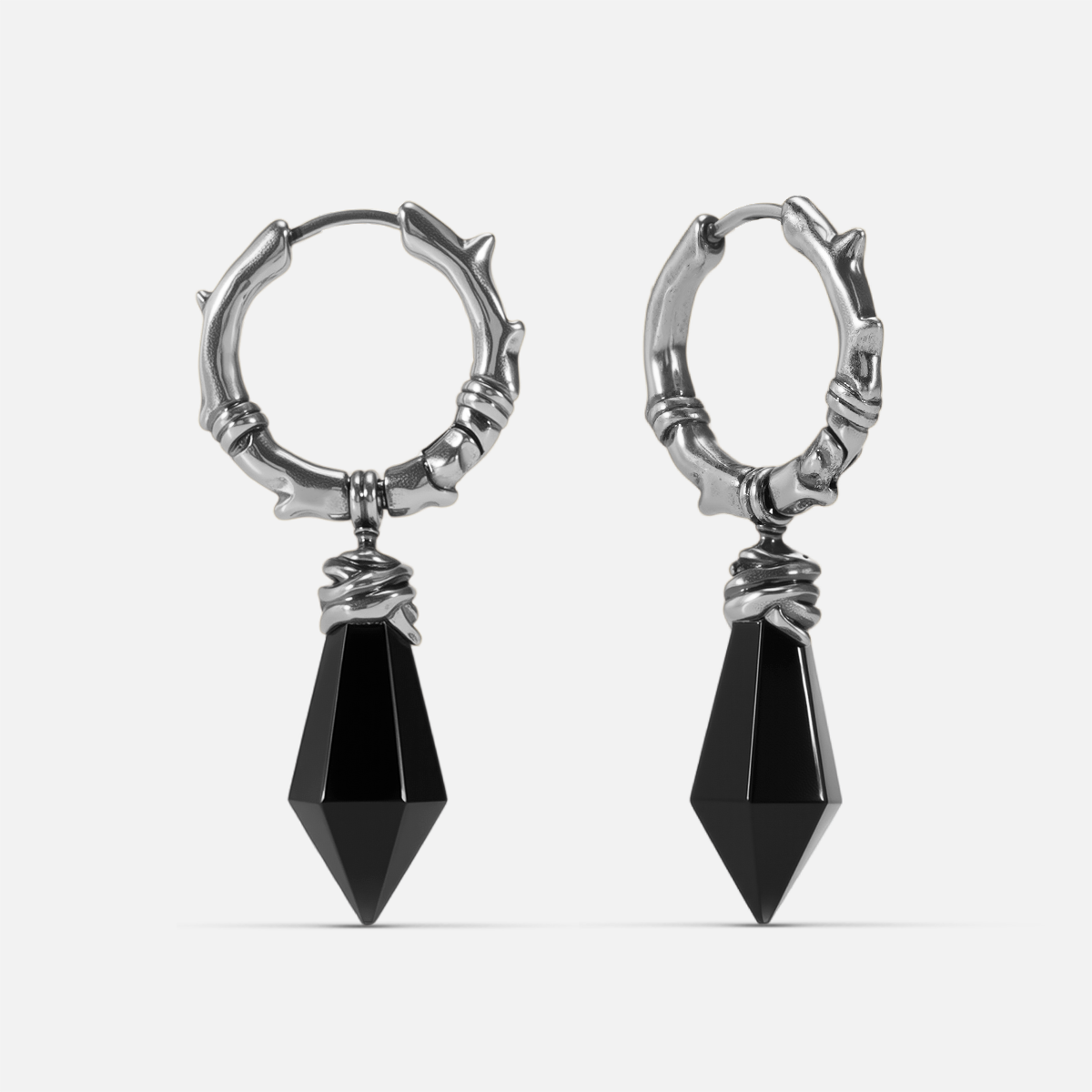 Silver Wrapped Relic Earrings with black obsidian dagger drops, hammered hoops, and wire-wrapped relic details on a clean background.