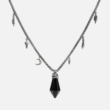 Black obsidian Wrapped Relic Necklace in silver tone, featuring a bound raw stone pendant, crescent charm, and relic-like chain details.
