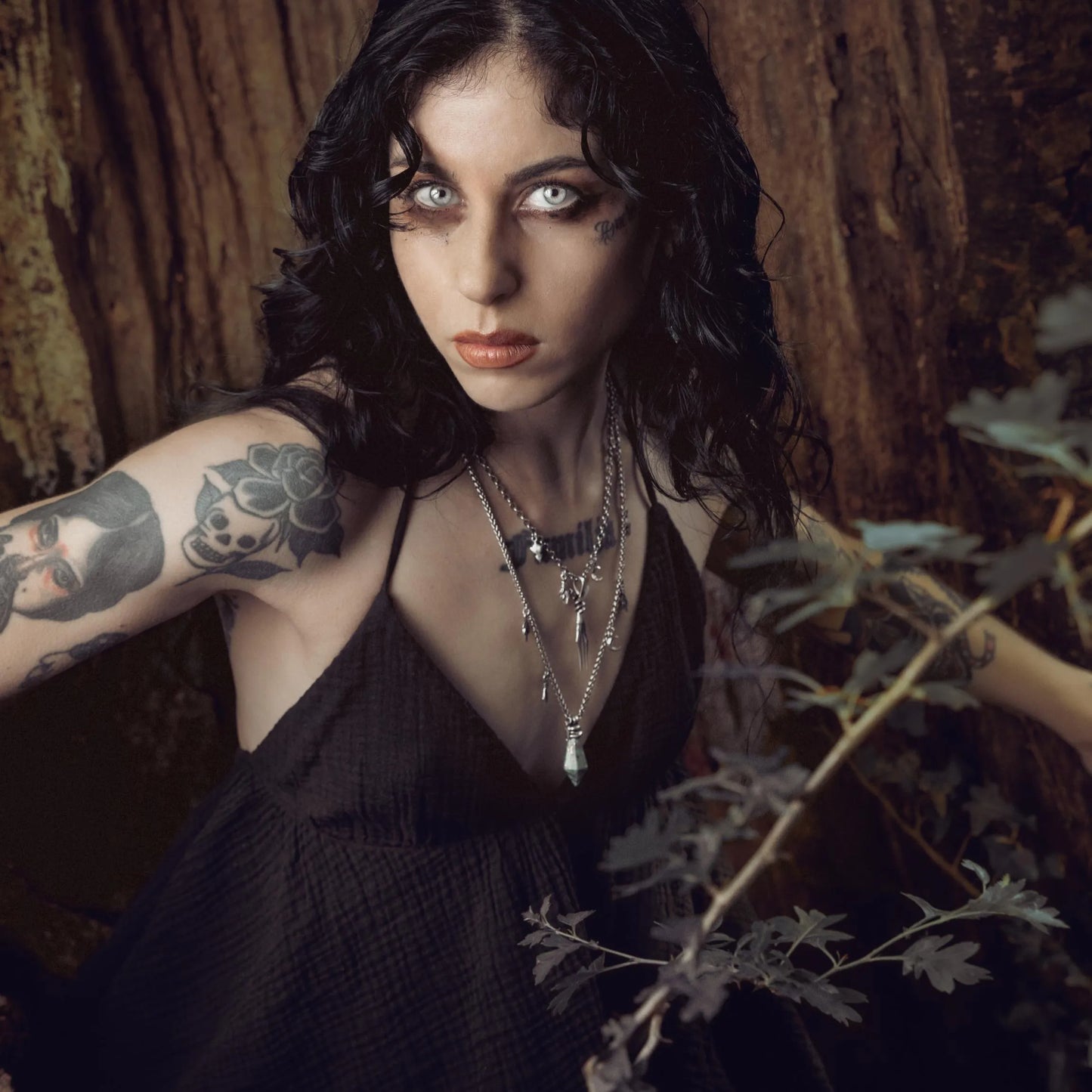 Wrapped Relic Necklace styled in a dark forest portrait with witchwood inspired jewelry mood